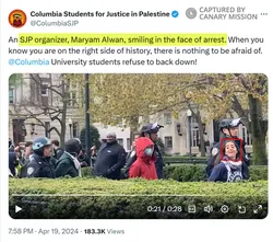 Columbia SJP praises Alwan as she smiles during her arrest at an illegal campus encampment in April 2024.
